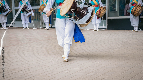 Musician play on a Korean traditional percussion musical instrument Janggu double-headed drum with a narrow waist in the middle. Samul nori or Pungmul on the festival of Korean culture
