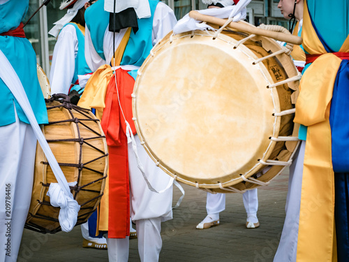 Blured picture of Musicians play on a Korean traditional percussion musical instrument Janggu. Samul nori or Pungmul on the festival of Korean culture