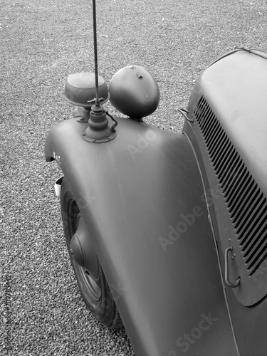 Matt lackierter Kotflügel eines Oldtimer aus französischen Armeebeständen des 2. Weltkrieg beim Oldtimertreffen in Lage bei Detmold am Teutoburger Wald in Ostwestfalen-Lippe in klassischem Schwarzweiß photo