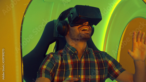 Surprised man experiencing virtual reality for the first time