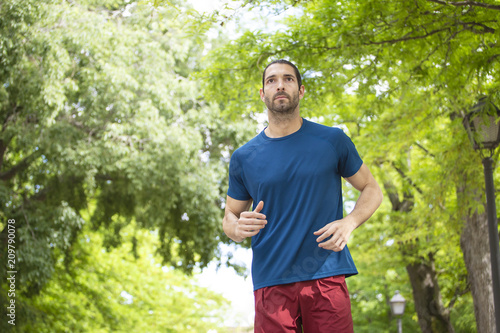 young man running in the park.