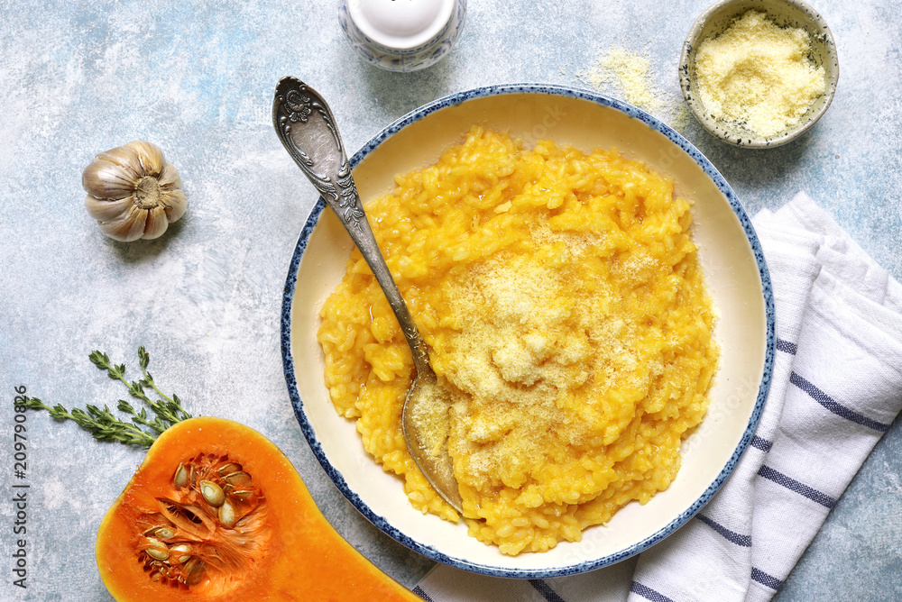 Delicious pumpkin risotto with garlic and thyme.Top view. Delicious pumpkin risotto with garlic and thyme.Top view.