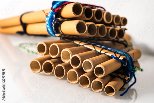 Traditional Pan flute of Mayan and Peruvian  on white background photo