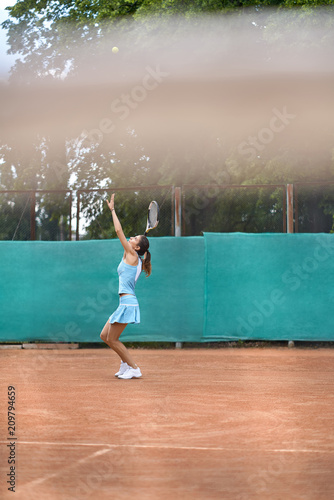 Sportive girl plays tennis
