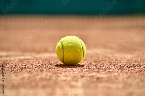Tennis ball on ground © Andriy Bezuglov