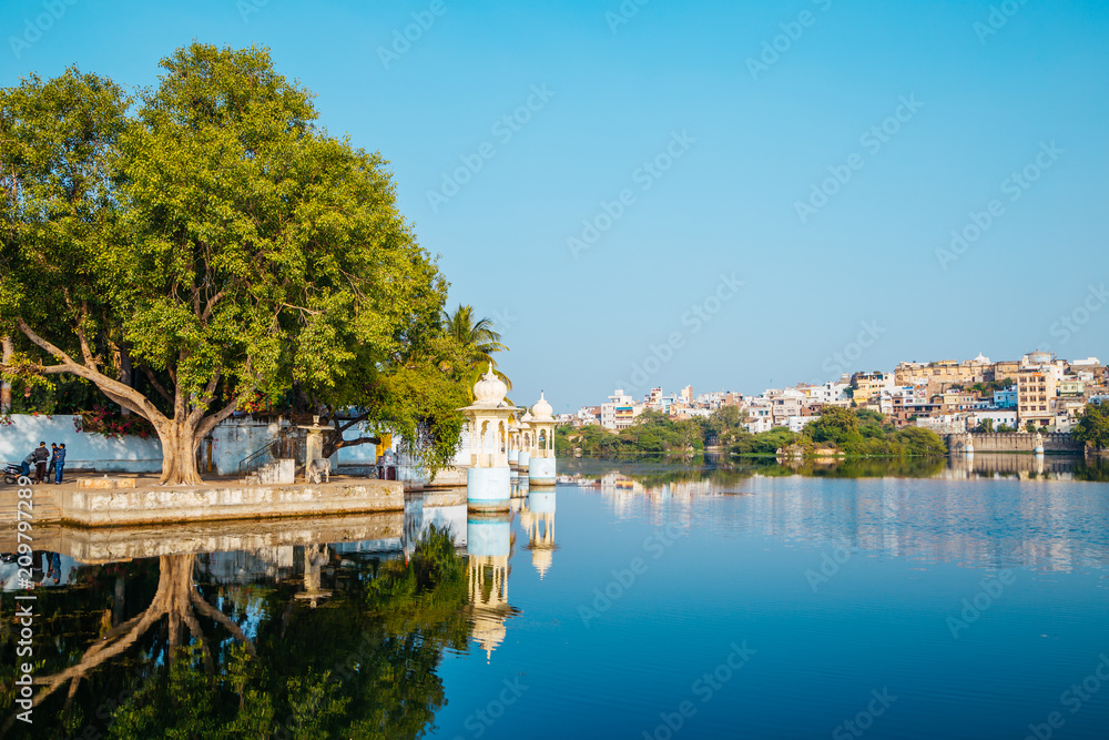 Pichola lake and old buildings in Udaipur, India