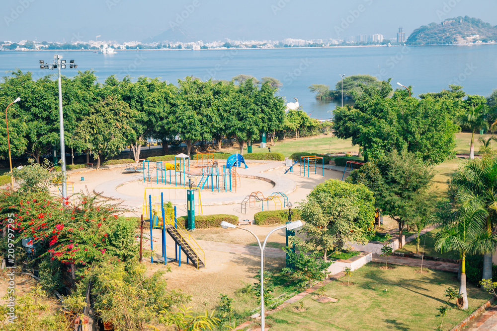 Colorful children playground park and Fateh Sagar Lake in Udaipur, India