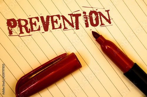 Text sign showing Prevention. Conceptual photos Stopping something from happening Healthcare ProtectionIdeas messages created on notebook page black red letters open pen resting.