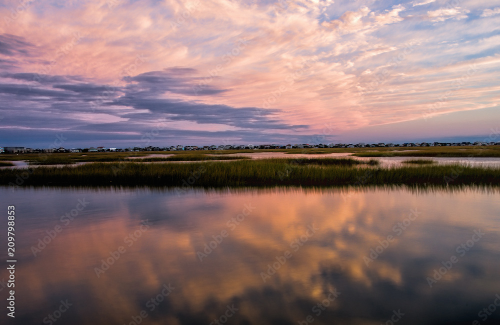 Sunset Colored Clouds with Reflection in Water