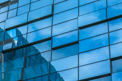 Clouds Reflected in Windows of Modern Office Building.