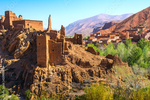Amazing view of a Kasbah's ruin on the way to Kasbah Ait Ben Haddou near Ouarzazate in the Atlas Mountains of Morocco. Artistic picture. Beauty world.
