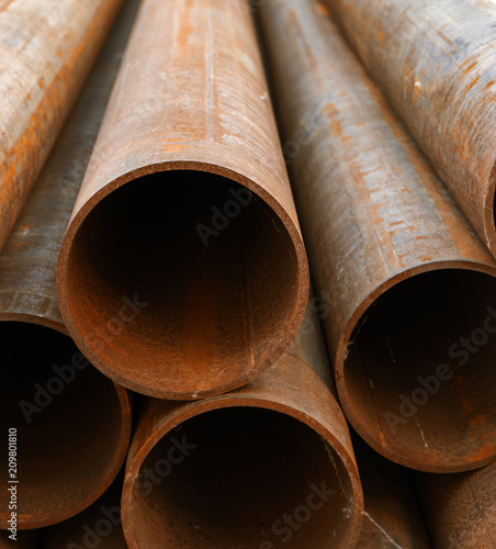 Rusty metal pipes in pile