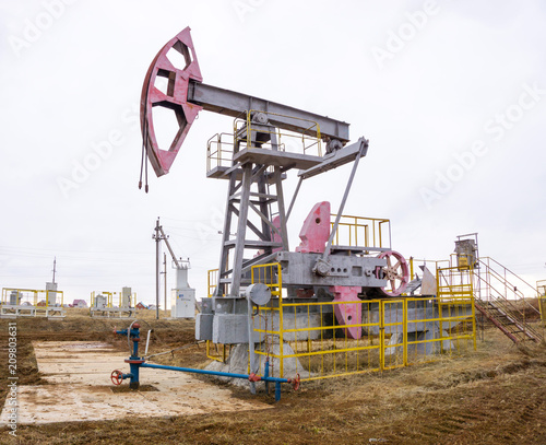 Oil pumps. Oil rocking chair. Oil industry equipment. Oil rocking chair closeup. Outdoor.