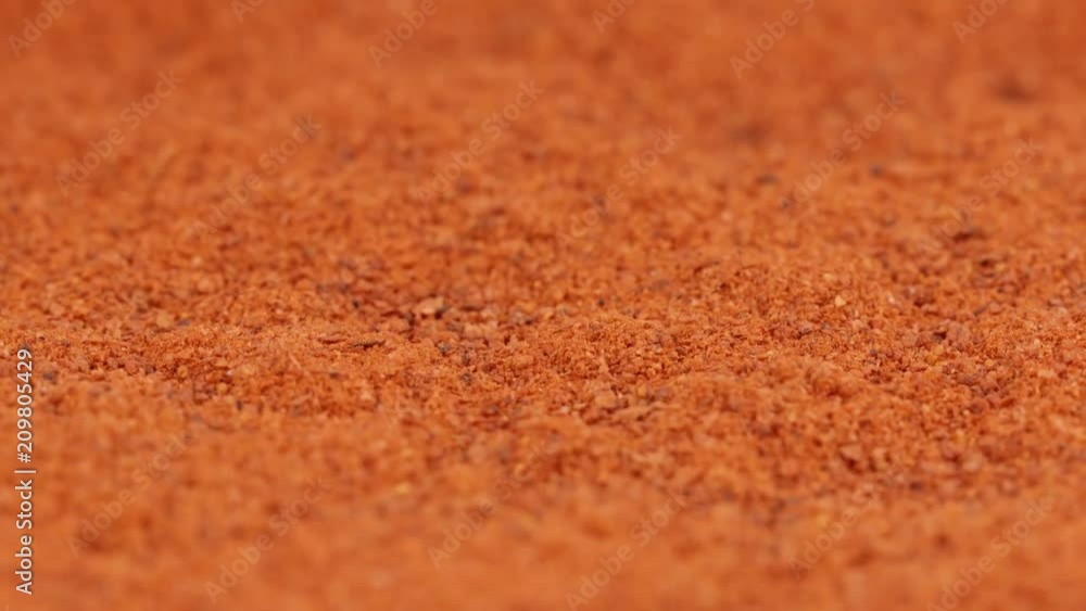 MACRO: Shaking of red pepper powder - Slow motion MACRO: Shaking of red pepper powder - Slow motion