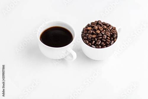 Coffee and coffee beans in white cups, white background