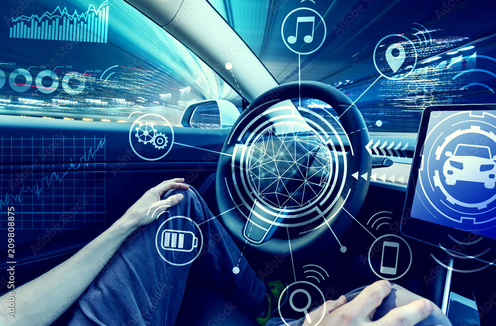 Person using a car in autopilot mode hands free StockFoto Adobe Stock