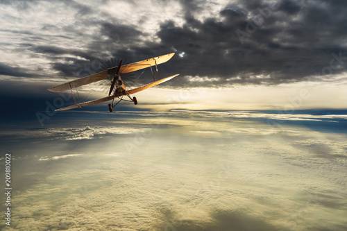 Old airplane on the blue sky