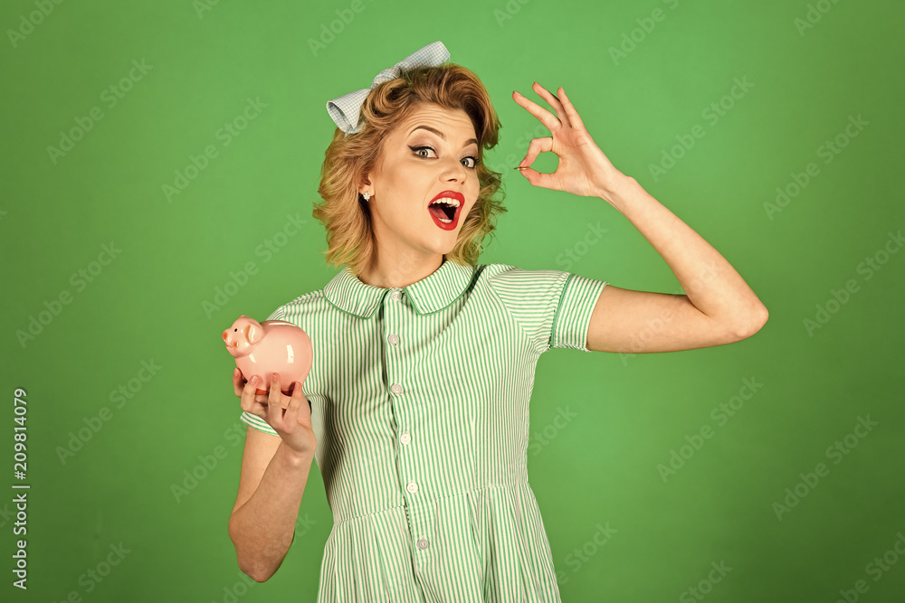 Fototapeta premium accounting of funds. Sensual girl save money for future.