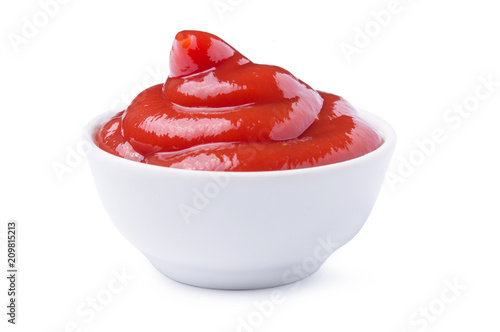 Red tasty ketchup or tomato sauce in bowl isolated on white background