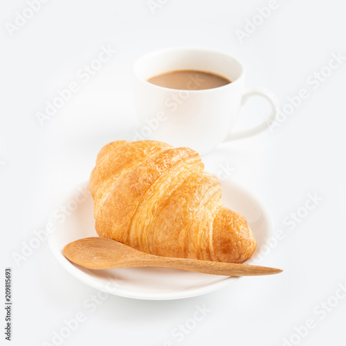 Coffee and croissant on white background