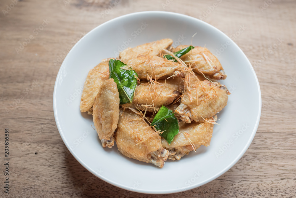 Fried chicken wings on rustic table Fried chicken wings on rustic table