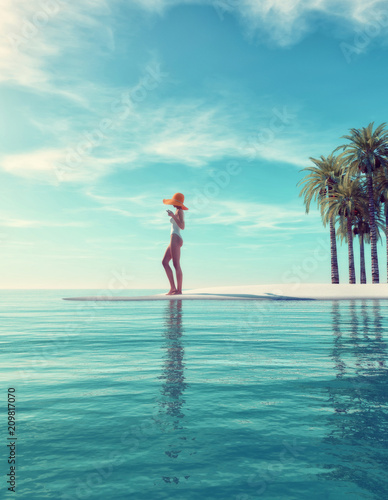 Tropical island - woman standing on tropical beach photo