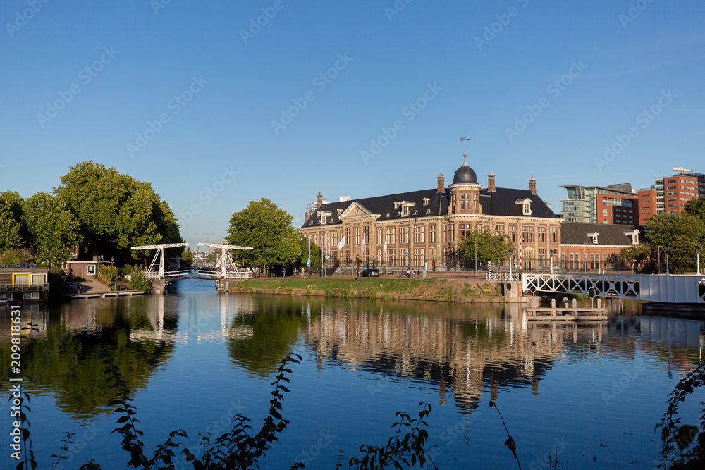 Waterview with mix of urban elements such as buildings and bridge reflected in the water Waterview with mix of urban elements such as buildings and bridge reflected in the water