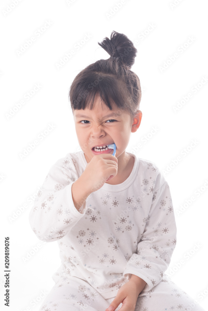 Little girl brushing her teeth isolated on white background Little girl brushing her teeth isolated on white background