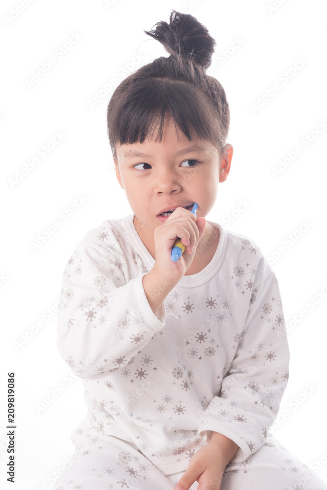 Little girl brushing her teeth isolated on white background Little girl brushing her teeth isolated on white background