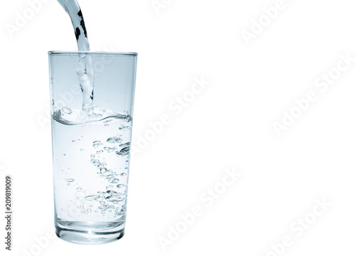 water to drink poured into a glass on a white background,clipping path included