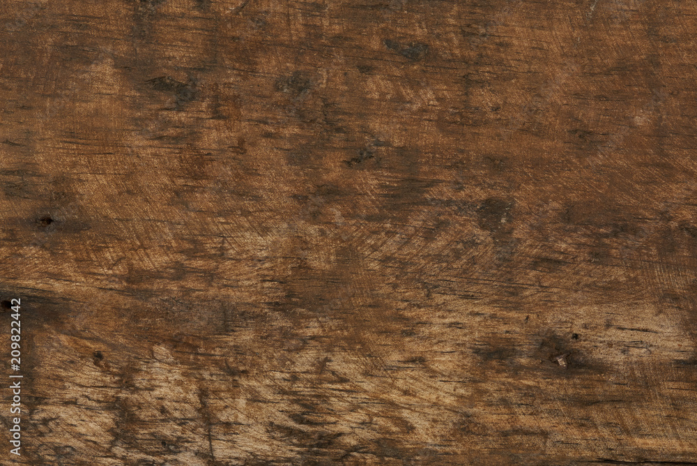 Scratched dark brown wooden background