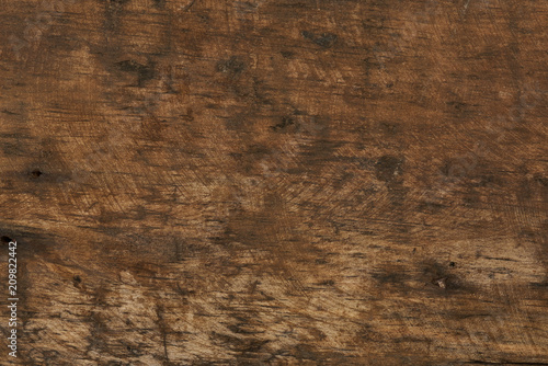 Scratched dark brown wooden background