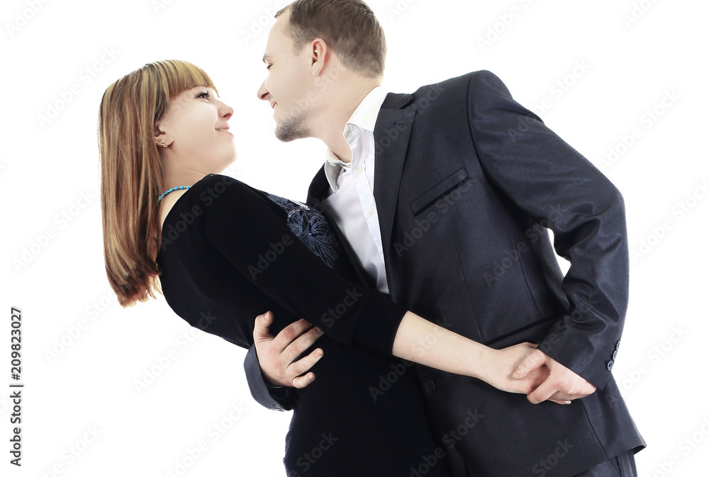 Photo of happy couple embracing each other and looking aside Photo of happy couple embracing each other and looking aside