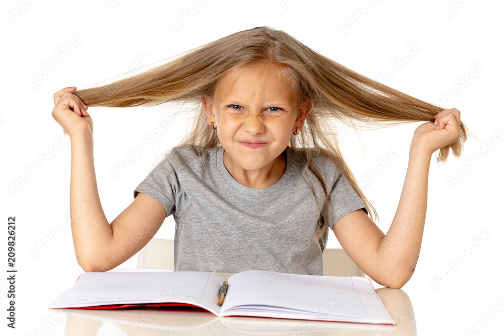 young girl pulling her hair in stress and over worked education concept young girl pulling her hair in stress and over worked education concept