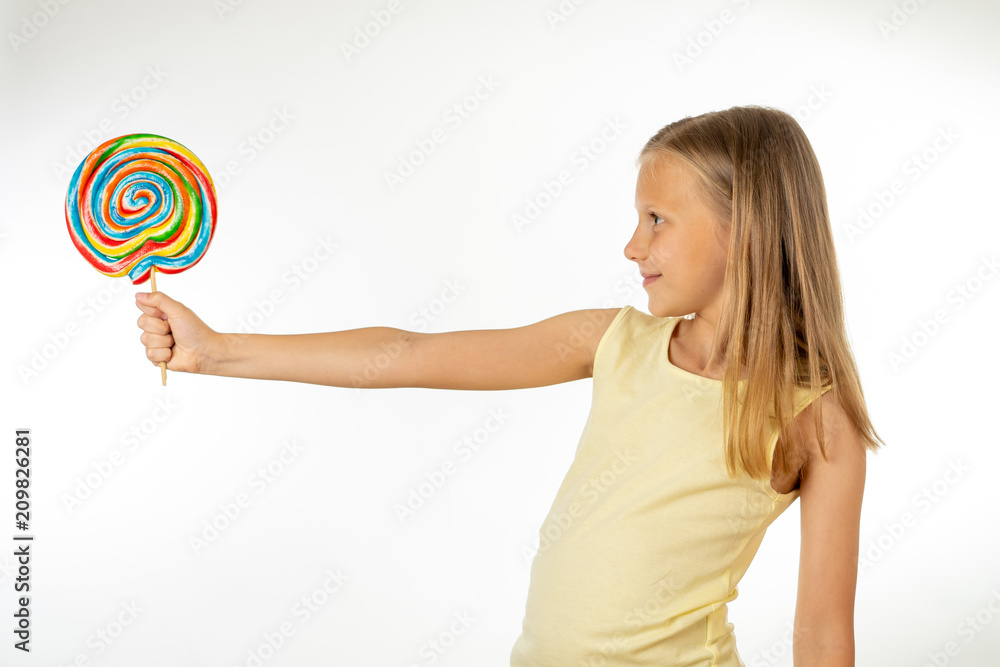 Beautiful little girl eating lollipop on white background Beautiful little girl eating lollipop on white background