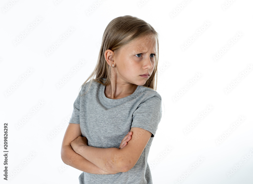 close up portrait of angry and sad little blonde girl on white back ground close up portrait of angry and sad little blonde girl on white back ground