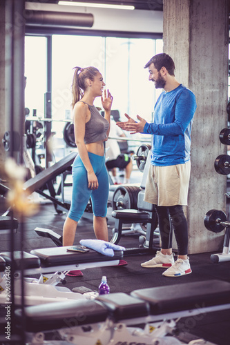 Laugh and talk at gym. photo