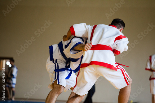 Fight of two athletes Asian Kuresh fight on the mat photo