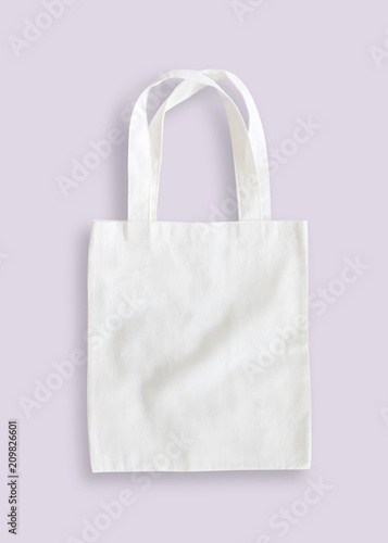 Tote bag mock up canvas fabric cloth shopping sack isolated with clipping path on purple background