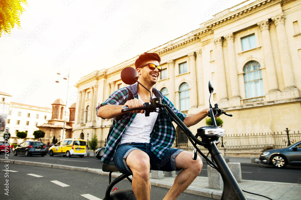 Fototapeta premium young man riding an electric vehicle