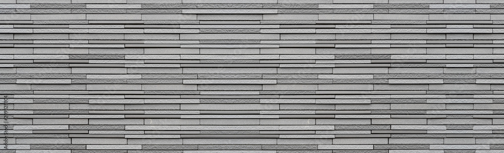 Fototapeta premium Panorama of Modern grey stone wall pattern and background