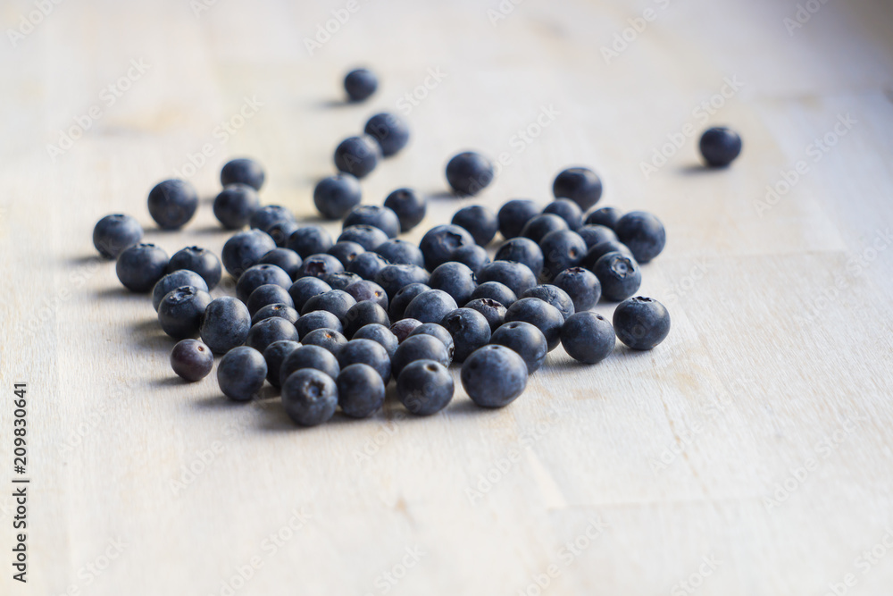 Many blueberries on wooden background Many blueberries on wooden background