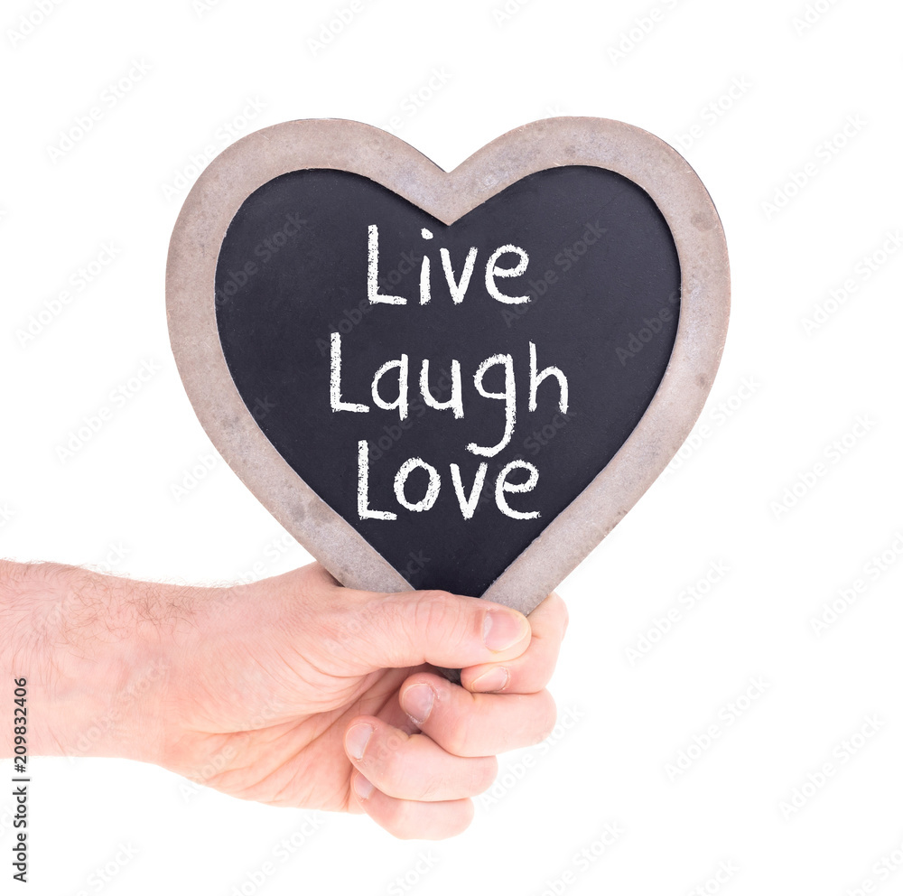Adult holding heart shaped chalkboard - Live laugh love Adult holding heart shaped chalkboard - Live laugh love