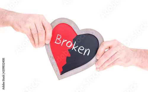 Adult holding heart shaped chalkboard - Broken photo