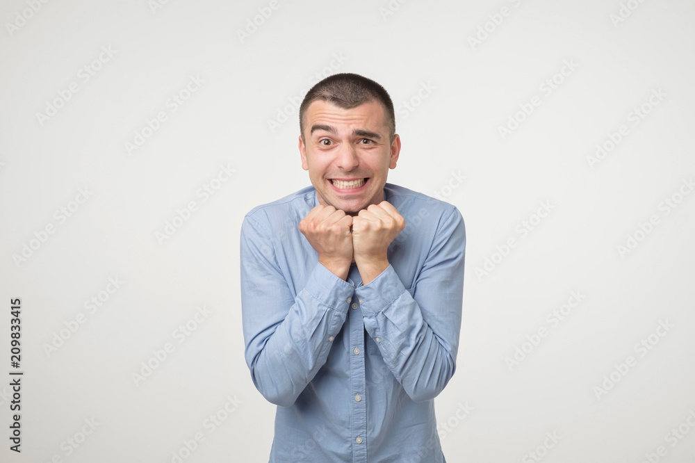 Concept of celebrating victory holding fists in deep emotional expression of happiness. Concept of celebrating victory holding fists in deep emotional expression of happiness.