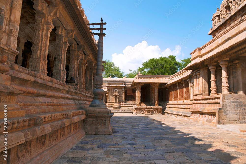 Flagpost and 100 pillar Maha-mandapa, Airavatesvara Temple, Darasuram, Tamil Nadu. Nataraja mandapa is seen at the end. View from South East.