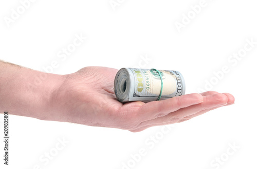  outstretched hand with a bundle of dollars on a white background