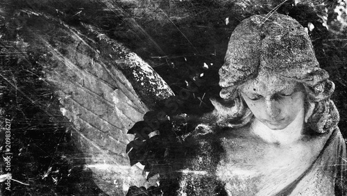 Fototapeta Vintage image of a sad angel. Retro stylized.