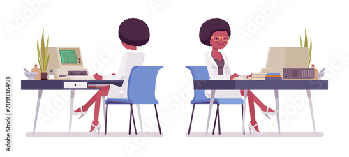 Female black scientist working at desk