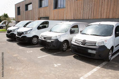 delivery vans ready to leave to deliver the parcels, park in front of the head office of the company © OceanProd
